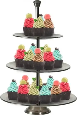 A three-tiered cake stand filled with cupcakes.