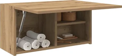 A bathroom wall cabinet with its top door open, showing towels and bathroom accessories inside.