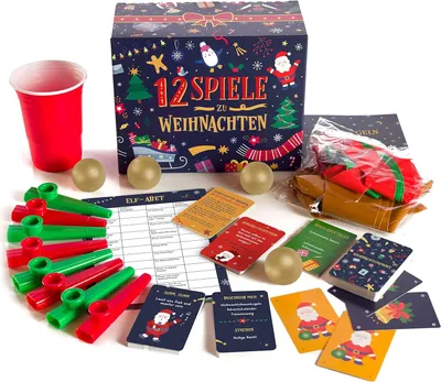 A collection of Christmas-themed party games and accessories laid out on a white surface.