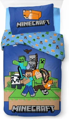 A Minecraft-themed duvet cover and pillowcase set laid out on a bed.