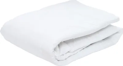 A white folded duvet on a white background.