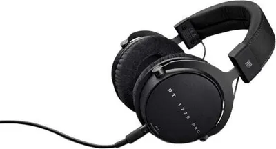 A pair of black studio headphones with a cable.