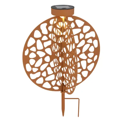 A solar-powered garden light with a decorative, cut-out design.