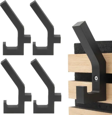 A set of black coat hooks mounted on wooden acoustic panels.