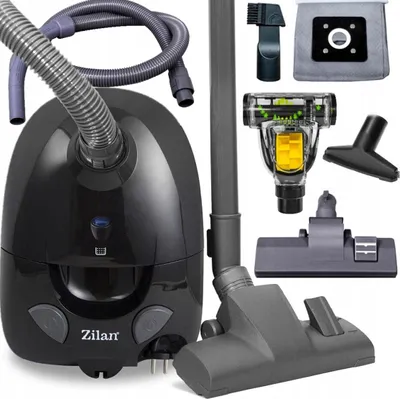 A collection of vacuum cleaner parts and accessories laid out on a white background.