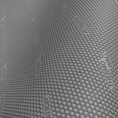A close-up, angled view of a perforated gray material, likely a wallpaper or insulation product, with text subtly embossed on its surface.