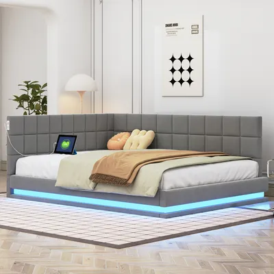 A modern gray upholstered bed with built-in LED lighting and a corner headboard.