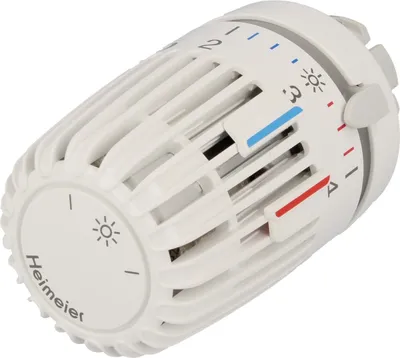 A white thermostat head with temperature markings.