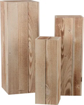 Three wooden pedestals of varying heights are arranged together against a white background.