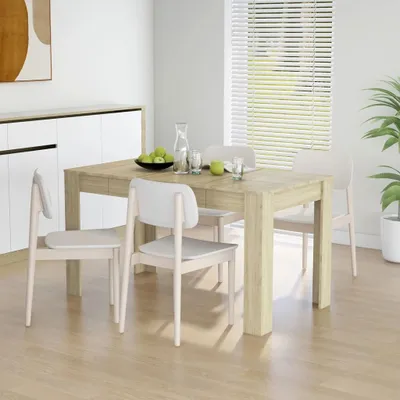 A dining table and chairs set in a dining room.