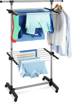A multi-tiered clothes drying rack with various items of clothing on it.