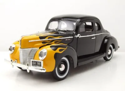 Produktbild von Motormax 73108SWF Ford Deluxe Coupe 1940 schwarz mit Flammen 1:18