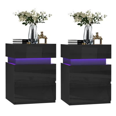 Two black nightstands with purple LED lighting, each topped with a vase of flowers and books.