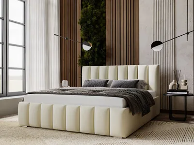 A modern bedroom with a beige upholstered bed as the main focus.