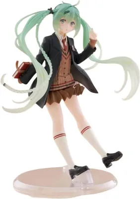 A figurine of Hatsune Miku in a school uniform, holding a book.