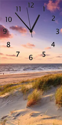 Produktbild von Wallario Design Wanduhr bedruckt, Größe 30 x 60 cm, Motiv: Abendspaziergang am Strand - Sonnenuntergang über dem Meer