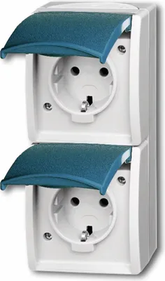 A close-up studio shot of two stacked white electrical outlets with blue protective covers.