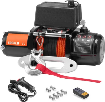 A black and orange electric winch with a red strap and hook, along with accessories like a remote control and bolts, is displayed against a white background.
