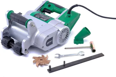 A wall chaser tool and its accessories are laid out on a white background.