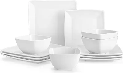 A set of white square plates and bowls arranged on a white background.
