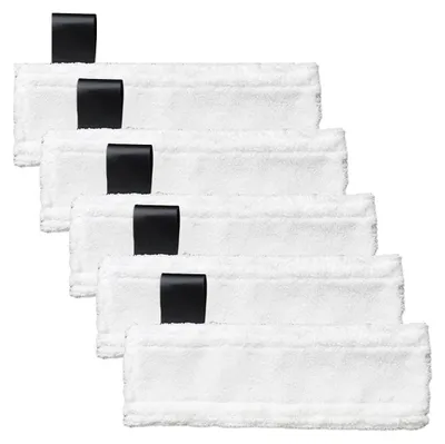 A stack of white cleaning pads with black tabs.