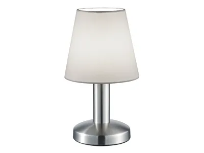 A table lamp with a white fabric shade and a silver base.