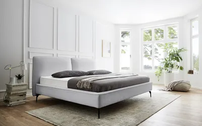 Produktbild von Meise Möbel Polsterbett Infinity 180x200 cm | Doppelbett | Bettgestell | Kopfteil in Kissenoptik | Webstoff Taubengrau | Metallfuß schwarz