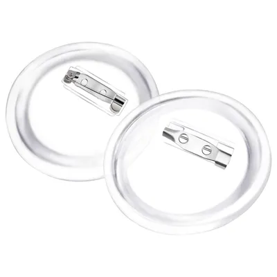 Two clear plastic badge components with metal pin backs.