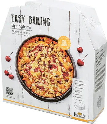 The image shows the packaging of a springform baking pan, featuring a picture of a finished cake.