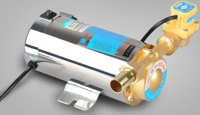 A close-up studio shot of a water pump with brass fittings and a yellow sensor.