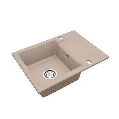 A beige speckled granite kitchen sink with a drainer board and a silver drain.