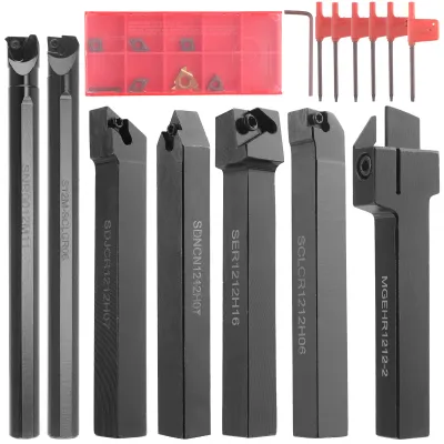 A collection of metalworking tools, including turning tool holders, inserts, and hex wrenches, laid out on a white background.