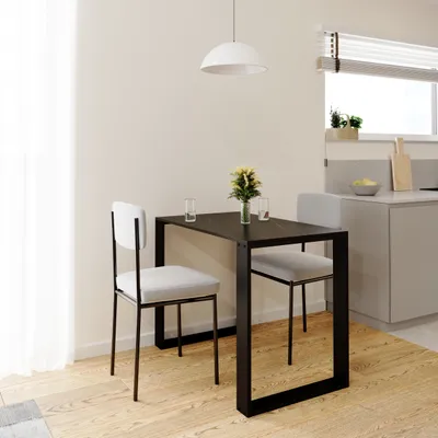 A small dining table with two chairs in a kitchen or dining area.
