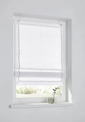 A white Roman blind with a subtle gray stitched trim is shown hanging in a window.