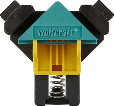A close-up studio shot of a corner clamp tool.