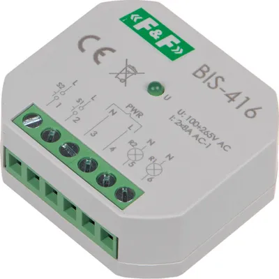 A close-up, angled view of a small, gray electronic device with green terminal blocks and a green LED indicator light.