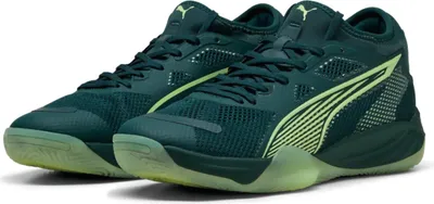 A pair of dark green Puma basketball shoes with neon yellow accents.