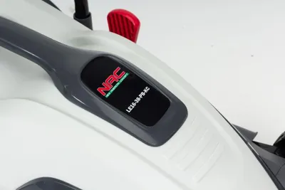 A close-up view of a lawnmower's handle and control panel.