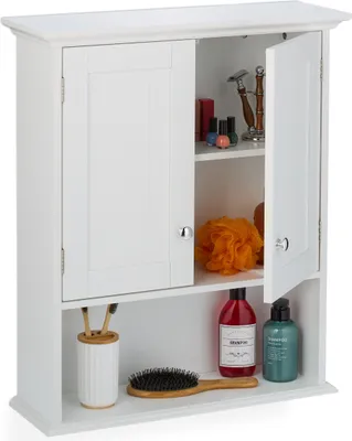 A white bathroom cabinet with two doors, one slightly ajar, revealing shelves with various bathroom items.