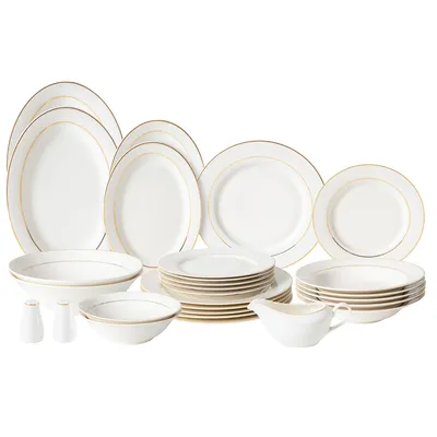 A collection of white porcelain dinnerware with gold trim, arranged on a white background.