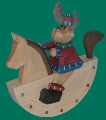 Produktbild von Holzfigur Elch auf Schaukelpferd Höhe 17cm NEU