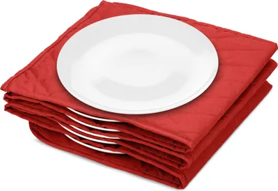 A stack of white plates on a red quilted mat.