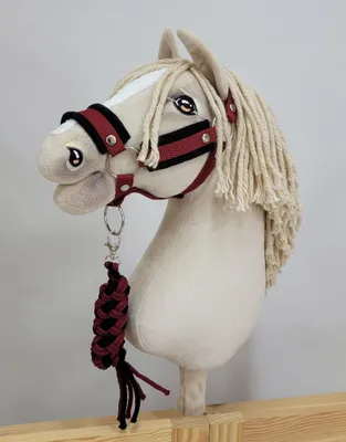 Produktbild von Hobby Horse Babybett A3 mit schwarzem Fell und doppelt geflochtenem Zügel
