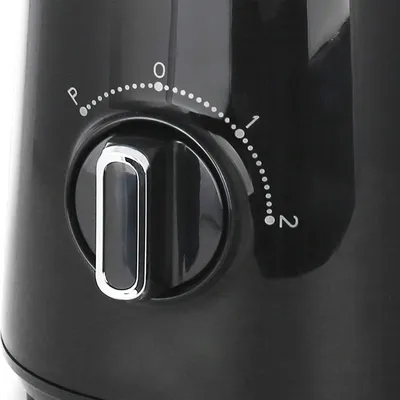A close-up view of a black appliance's control dial with numerical and alphabetical settings.