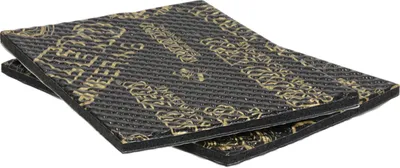 Two rectangular pieces of sound deadening material are stacked on top of each other.