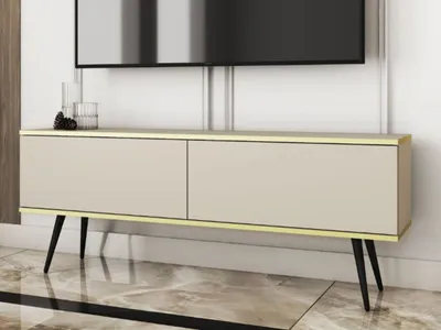 A modern TV stand with two doors and metal legs, placed in a living room setting.
