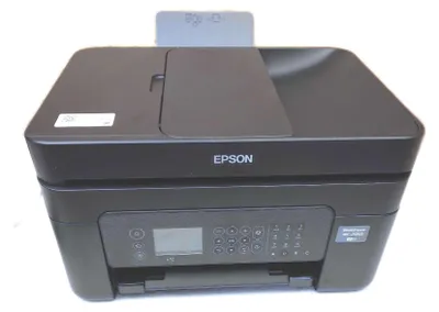 A black Epson WorkForce WF-2950DWF wireless multifunction printer is shown from a front-facing diagonal angle.