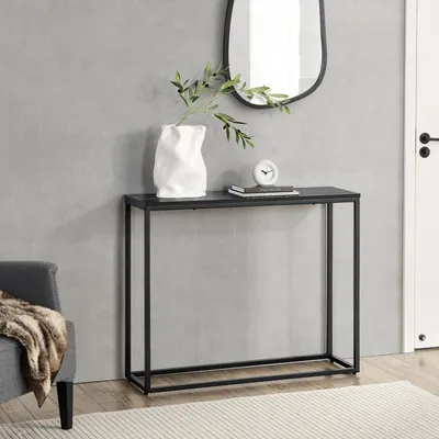 A console table with decorative items in a room setting.