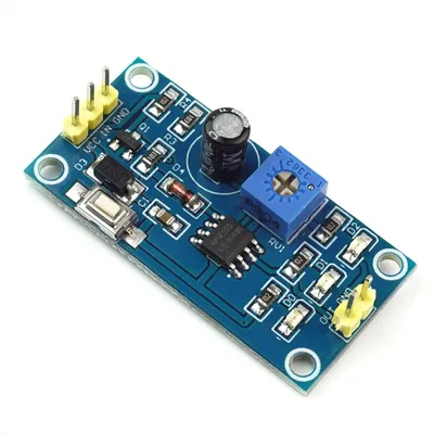 A close-up, high-angle shot of a blue electronic timer module breakout board with various components.