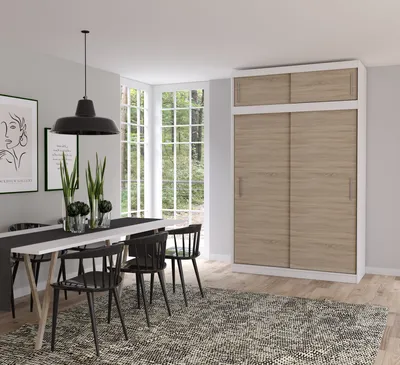 A dining room with a table, chairs, and a wardrobe.